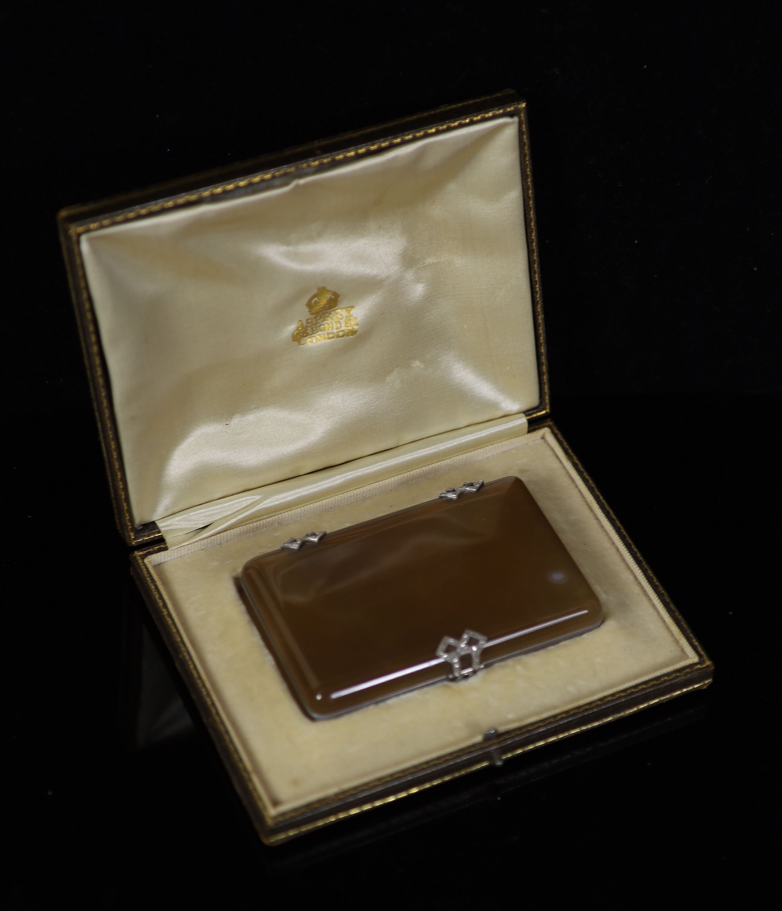 A 1920's French 18ct white gold, platinum and rose cut diamond set two colour agate rounded rectangular cigarette case, by Michel Ballada (Paris 1914-1922)